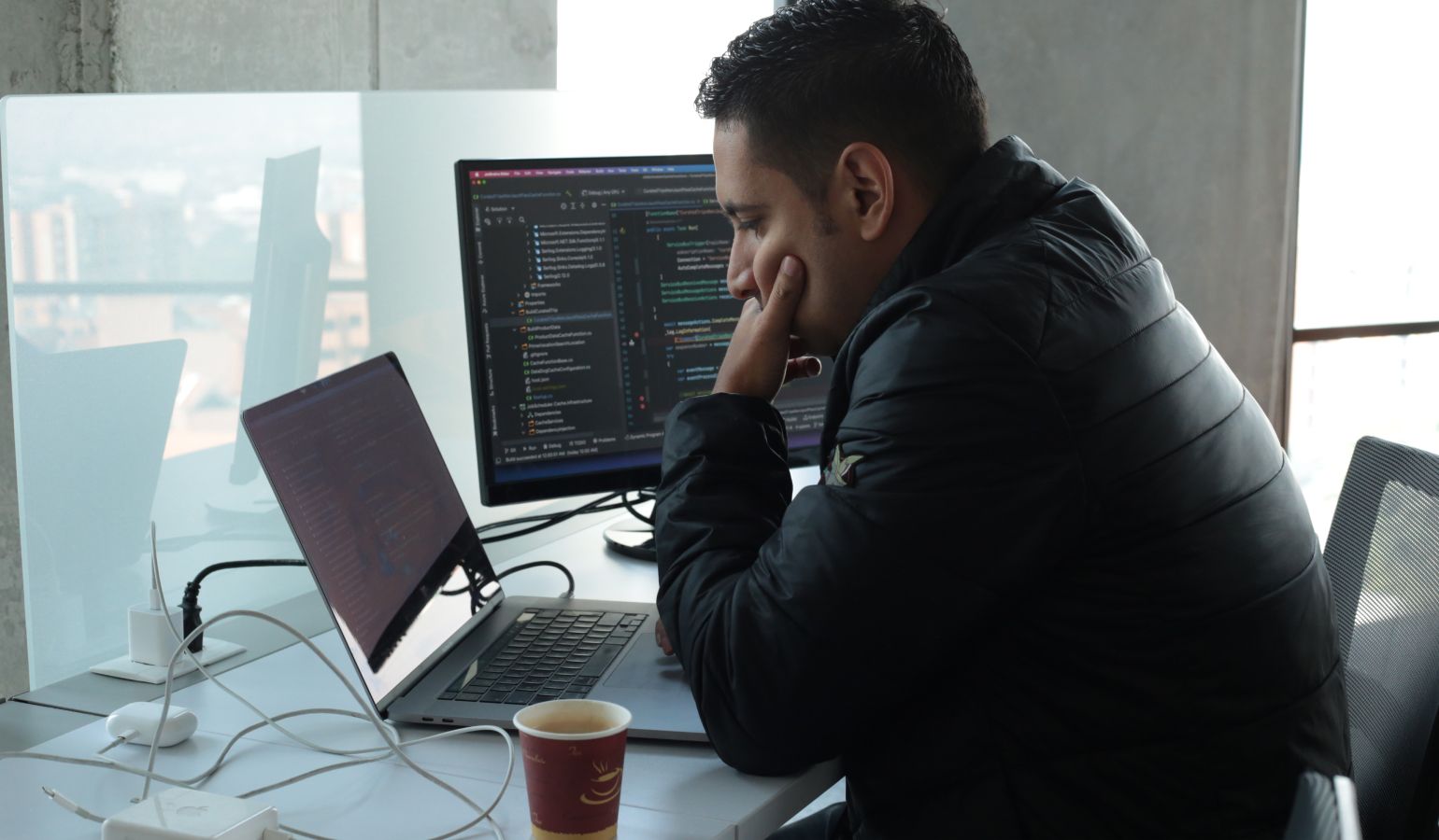 Gorilla Logic engineer reviewing code on computer